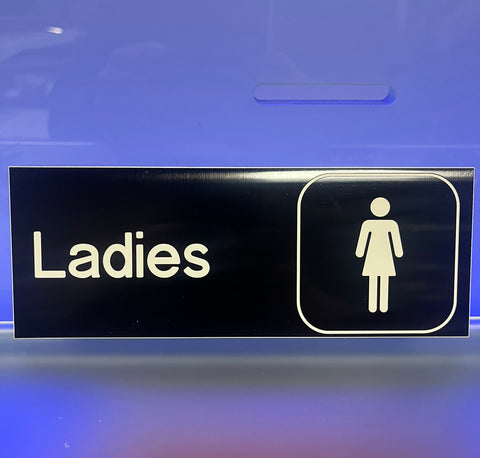 Ladies Washroom Sign on Black (8" x 3")